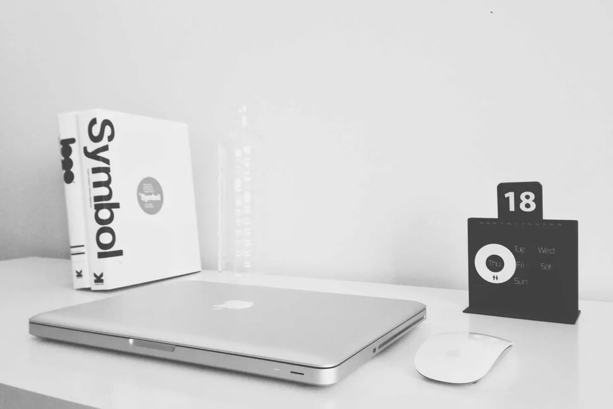 A creative studio desk with design work, representing brand identity